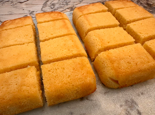 Abuelos Cornbread with Lemon Undertone (16 pieces) | Please contact us for pick up. Allow at least 2 business days between order and pick up date.